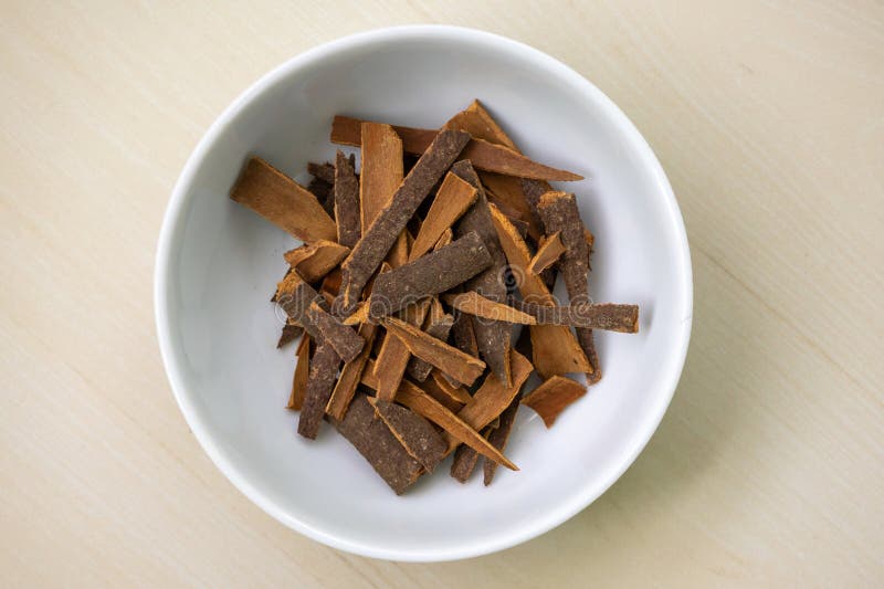 cinnamon-sticks-white-bowl-wooden-background-its-scientific-name-cinnamomum-verum-also-known-as-darchini-daruchini-318860879.jpg