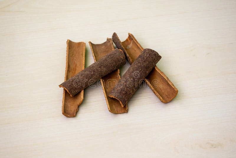 cinnamon-sticks-wooden-background-aromatic-condiment-cooking-318860857.jpg